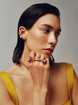 Model wearing Bee Goddess luxury 18k gold designer rings with ethical diamonds and precious gemstones
